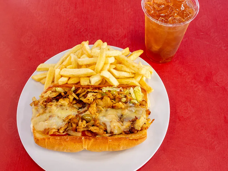 Hearty chicken cheesesteak sub with fries and iced tea at This is Seafood, a Seafood Restaurant in District Heights
